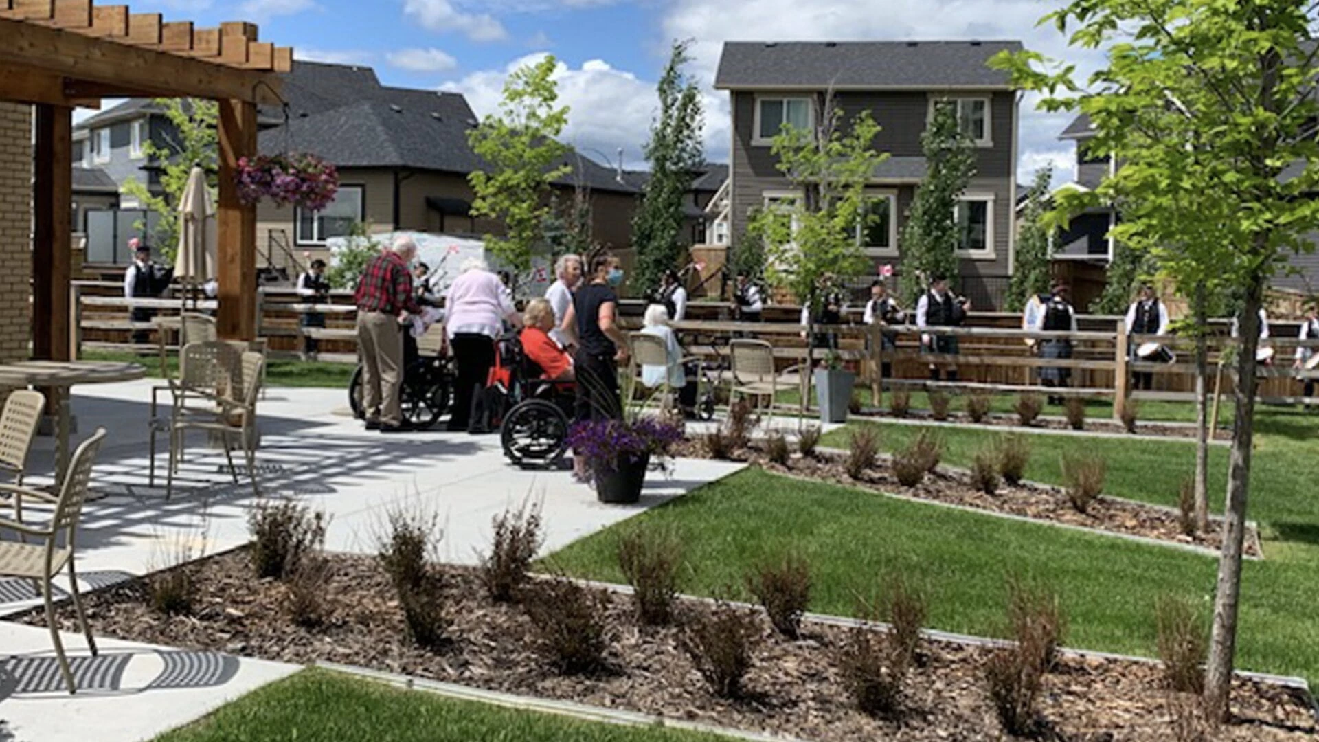 Residents of Hawthorne listening to band in the courtyard